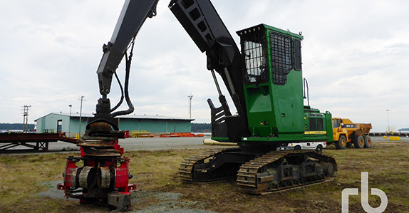 John Deere dangle head logging processor sold at Ritchie Bros. Auctioneers. John Deere dangle head logging processor sold at Ritchie Bros. Auctioneers.